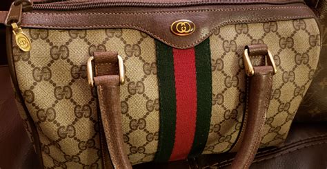 how do you tell if a gucci purse is real|gucci purse real.